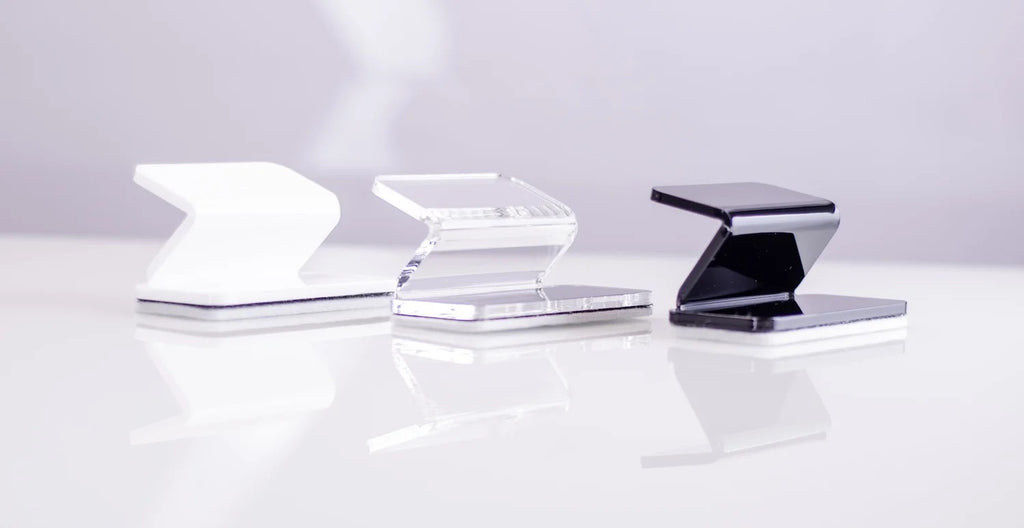 Three acrylic erasers in black white and clear